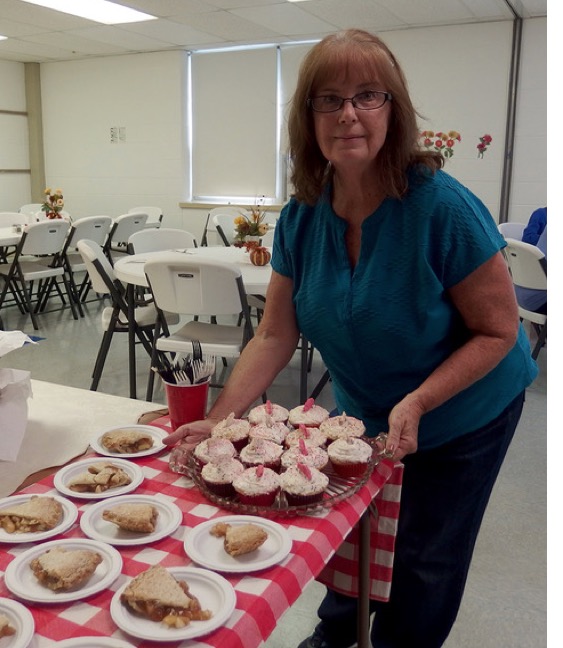 Carol setting out desserts for lunch.